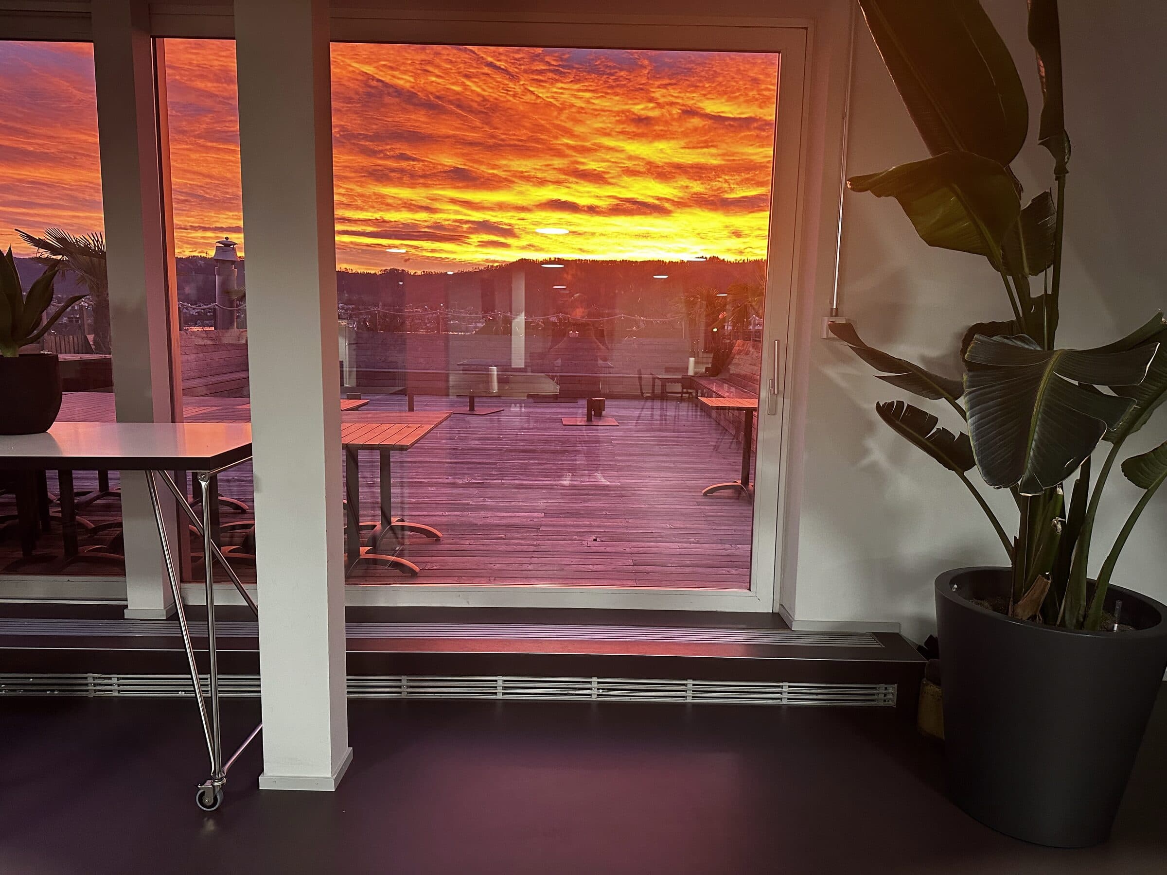 Lounge looking onto the terrace at sunset